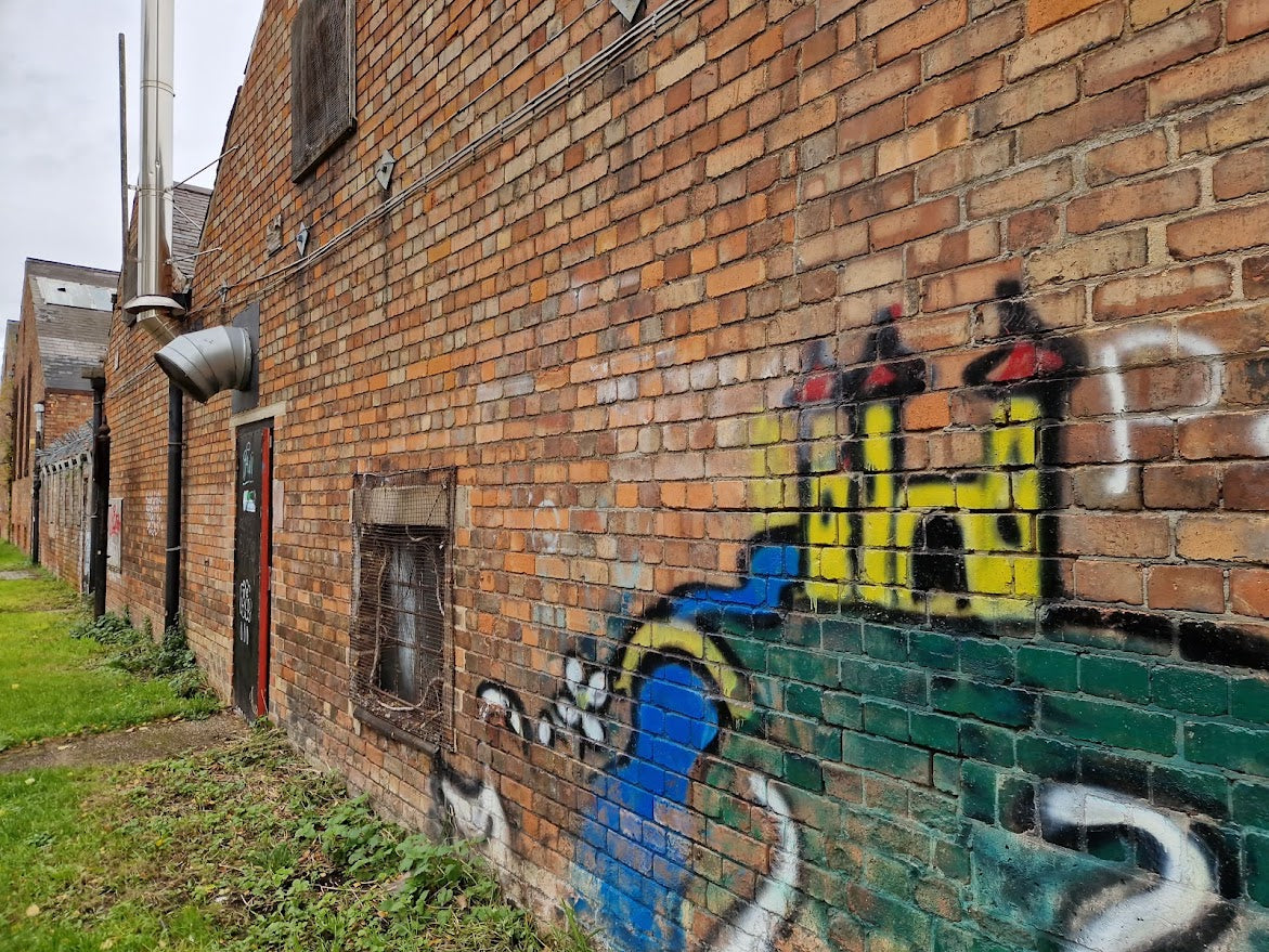 Graffiti on a brick wall with a colorful design